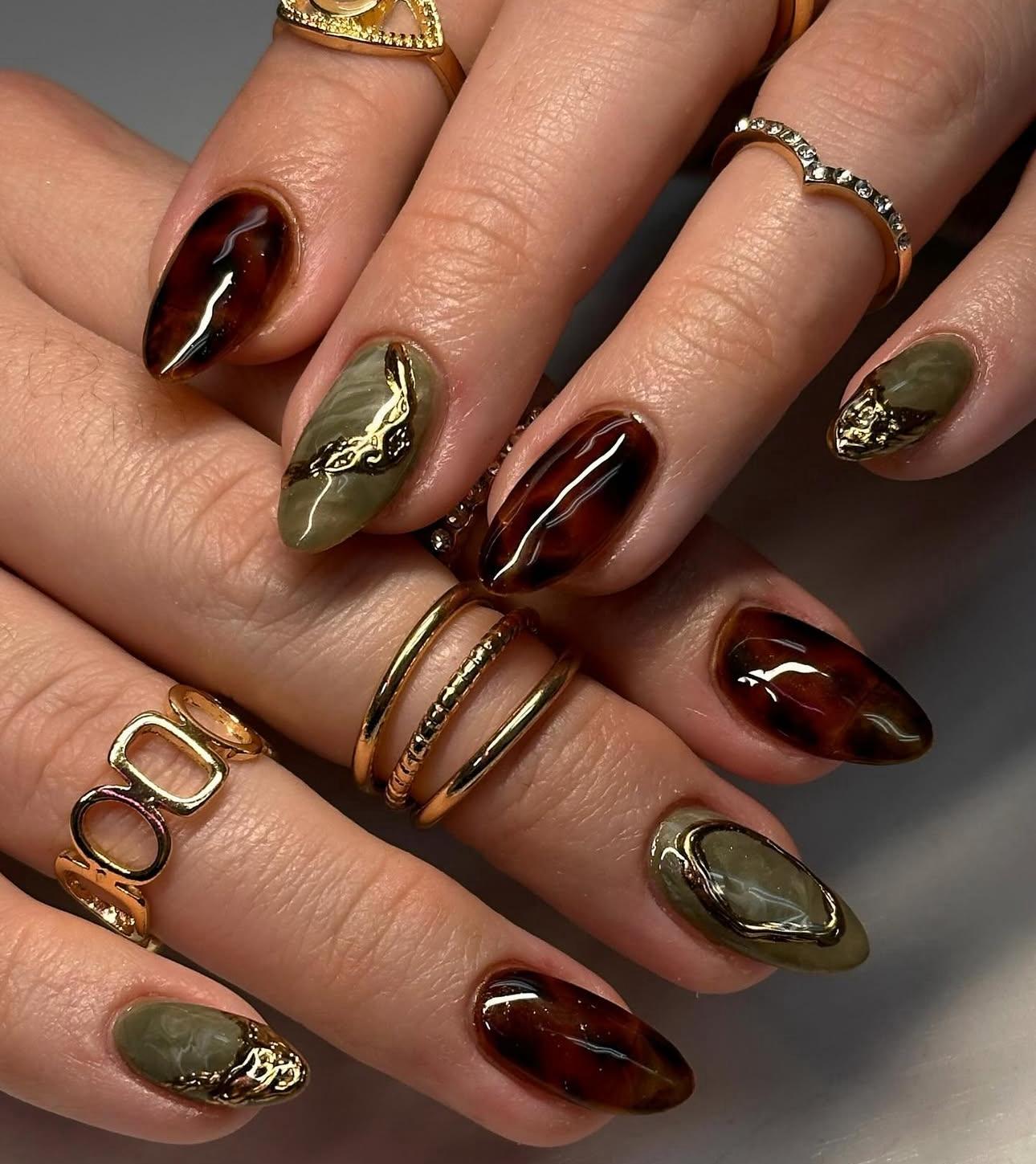 Hand wearing matcha gold Almond -shaped press-on nails
