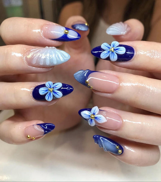 Hand wearing blue  Almond -shaped press-on nails