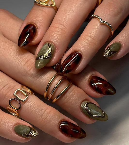Hand wearing matcha gold Almond -shaped press-on nails