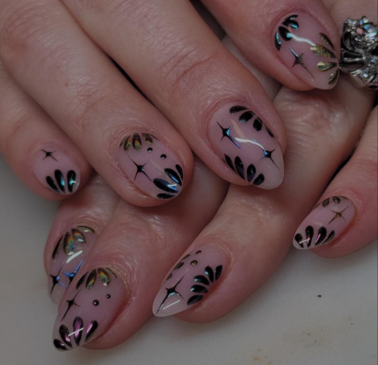 Hand wearing pink Almond -shaped press-on nails