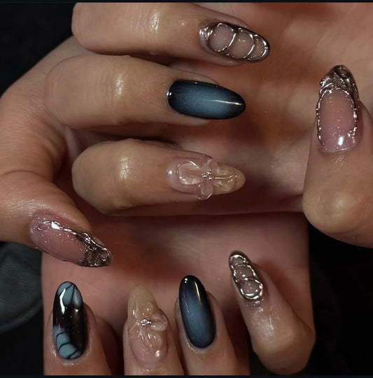 Hand wearing blue silver Almond -shaped press-on nails