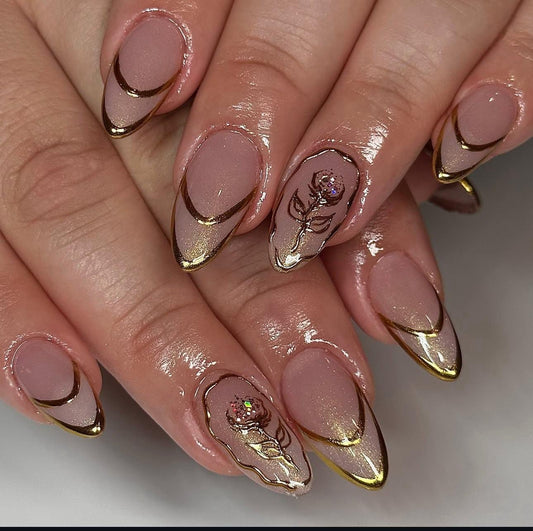 Hand wearing gold Almond -shaped press-on nails